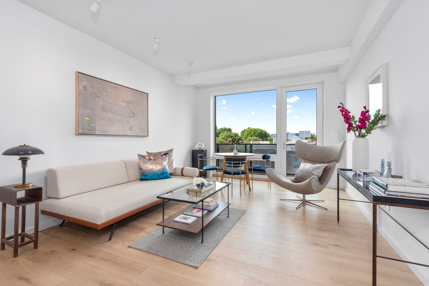 702 Hancock Street, Unit 3B Brooklyn, NY 11233 - Photo 4 of 16 a living room with furniture and a large window