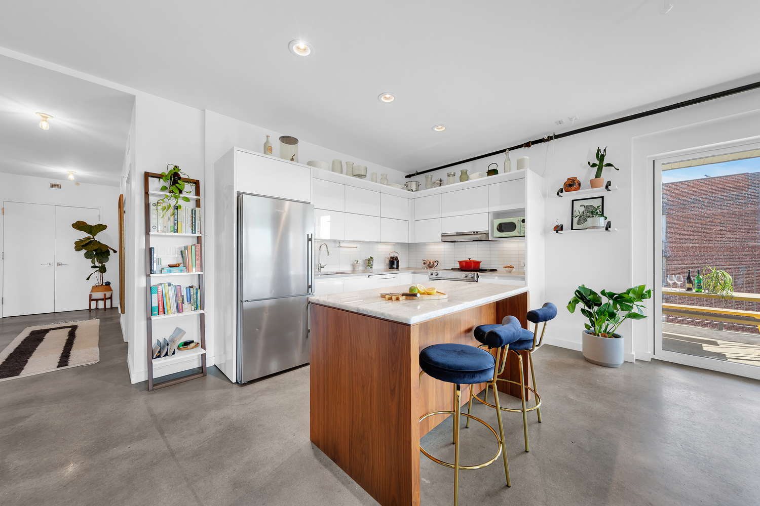 651 New York Avenue, Unit 604 Brooklyn, NY 11203 - Photo 3 of 13 a dining room with furniture and a kitchen
