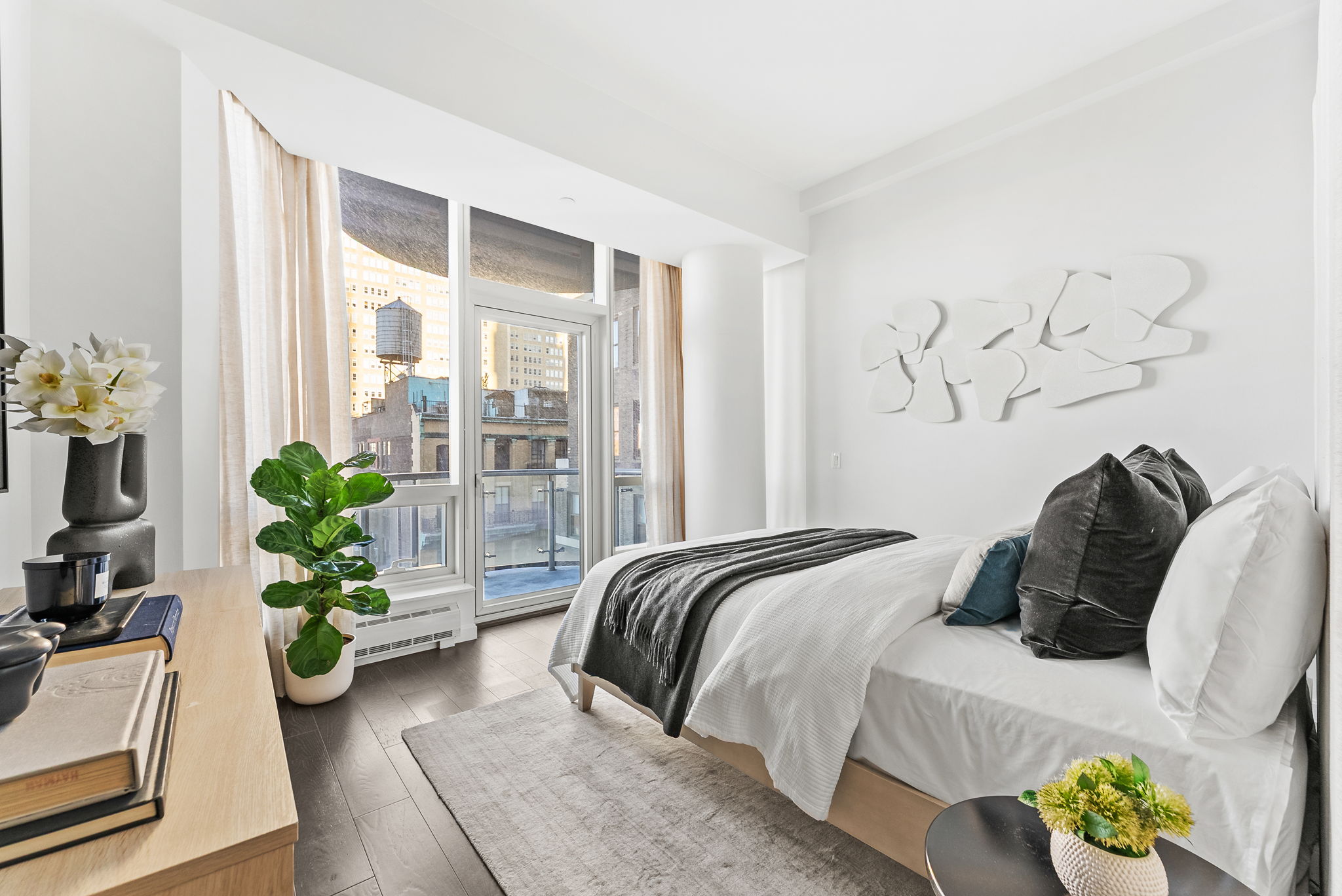 19 Park Place, Unit 14A Manhattan, NY 10007 - Photo 8 of 19 a bedroom with a bed and a potted plant
