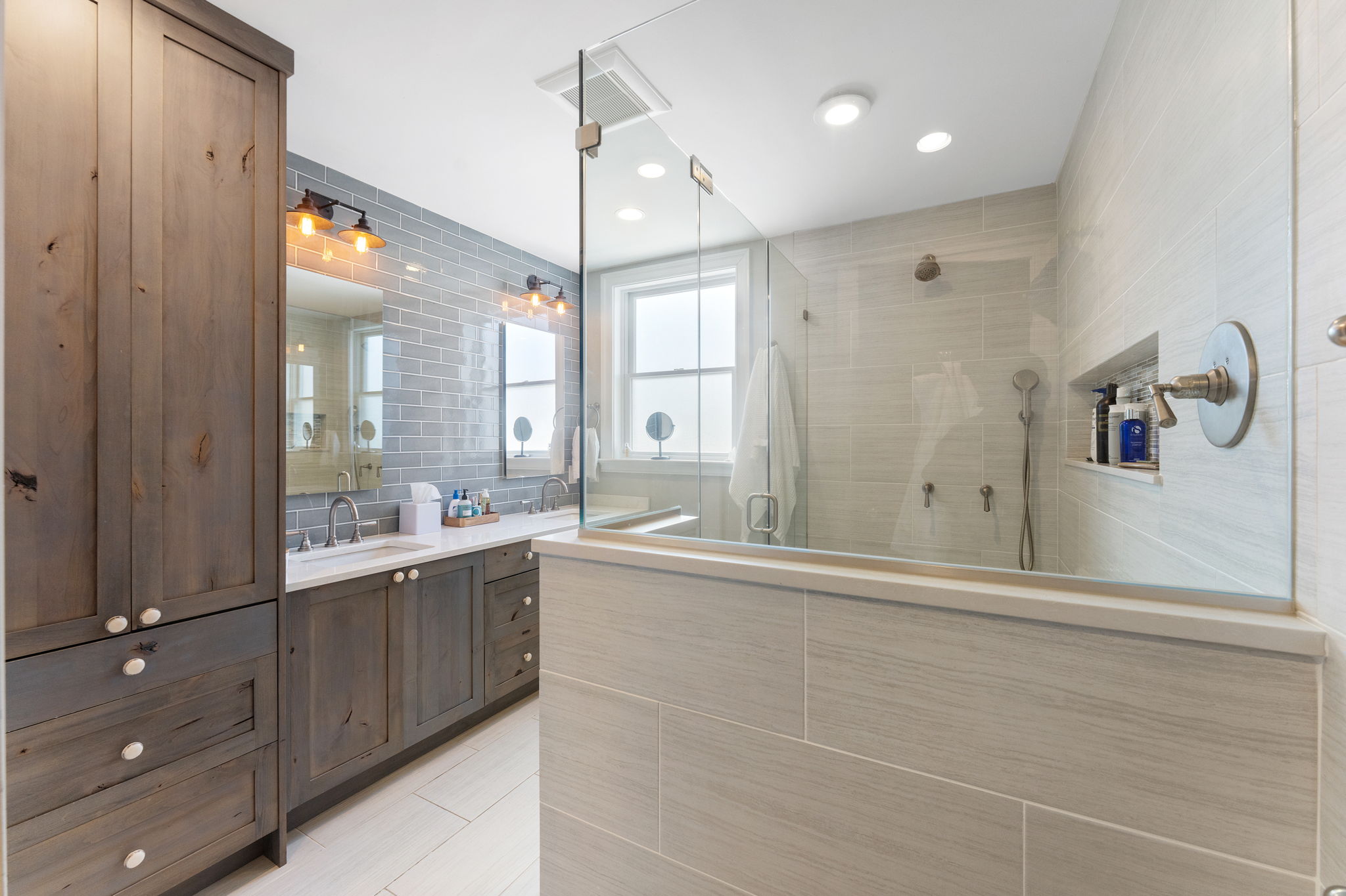 618 3rd Street Northeast Washington, DC 20002 - Photo 6 of 7 a large bathroom with a large mirror vanity and shower
