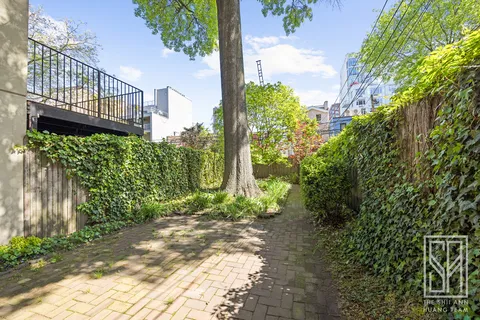 a view of a pathway along the garden