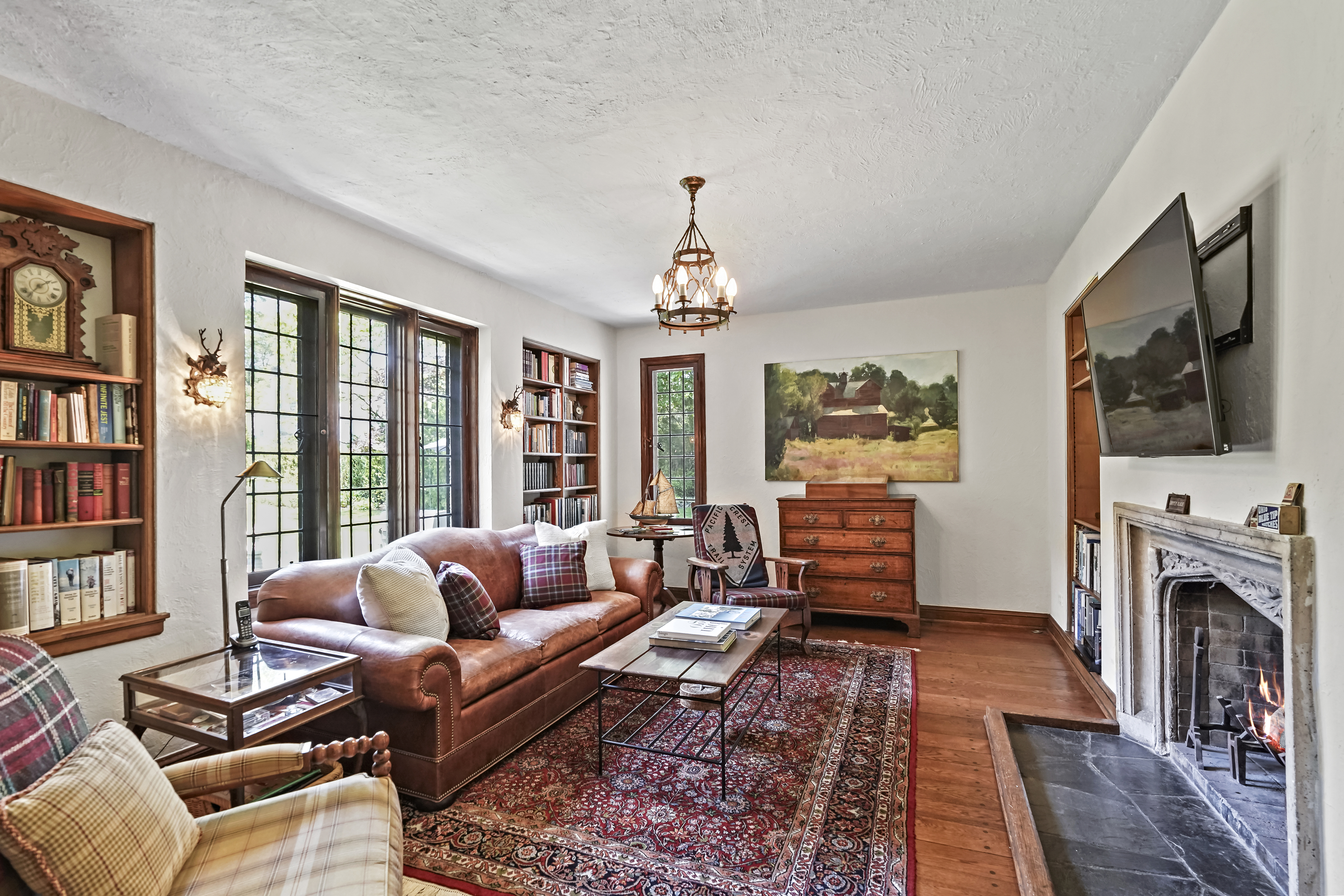 19 Avon Road Larchmont, NY 10538 - Photo 10 of 35 a living room with furniture fireplace and flat screen tv