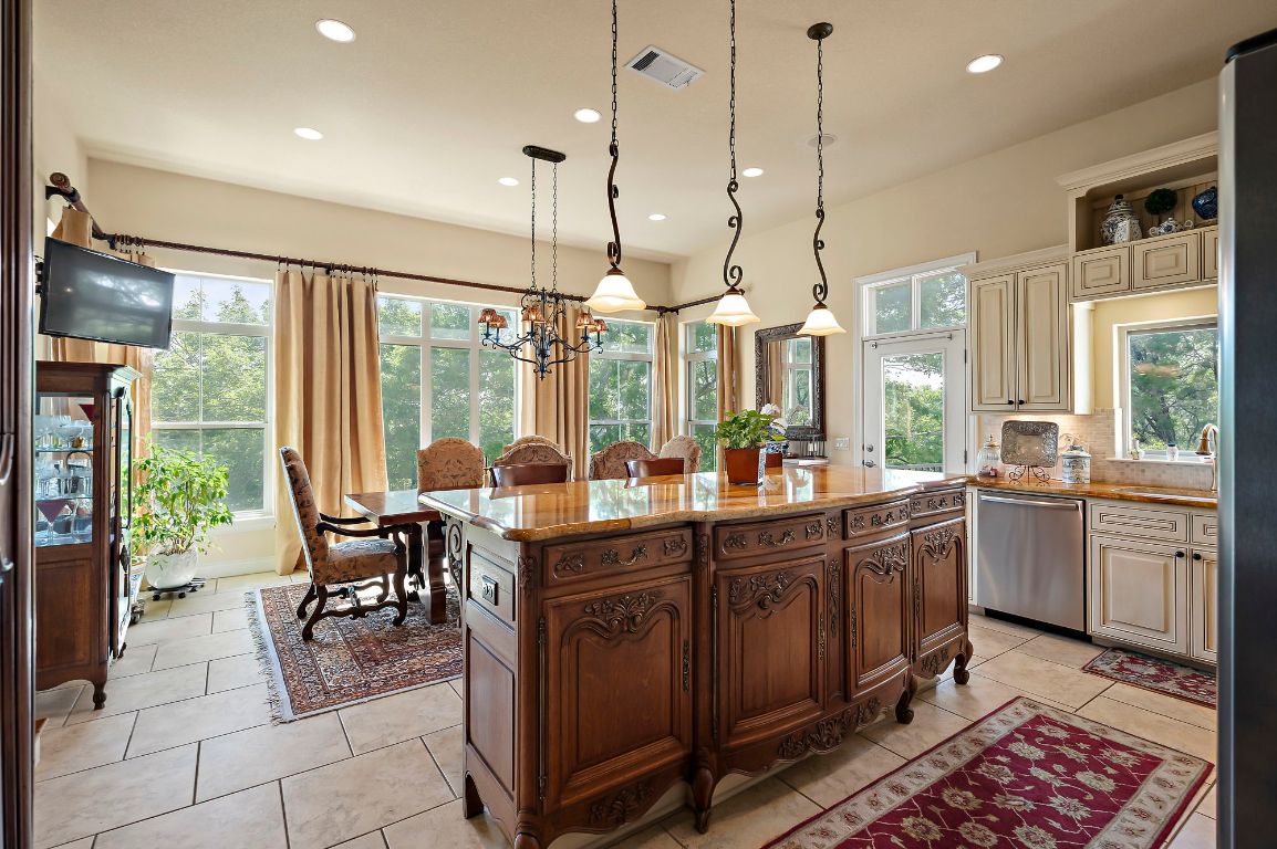 1607 The High Road Austin, TX 78746 - Photo 10 of 28 a very nice looking kitchen with a large window