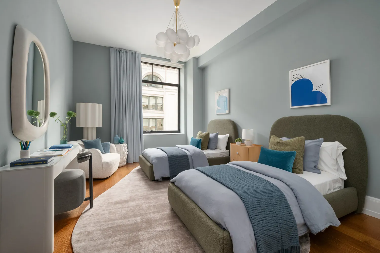 a bedroom with two beds and a couch