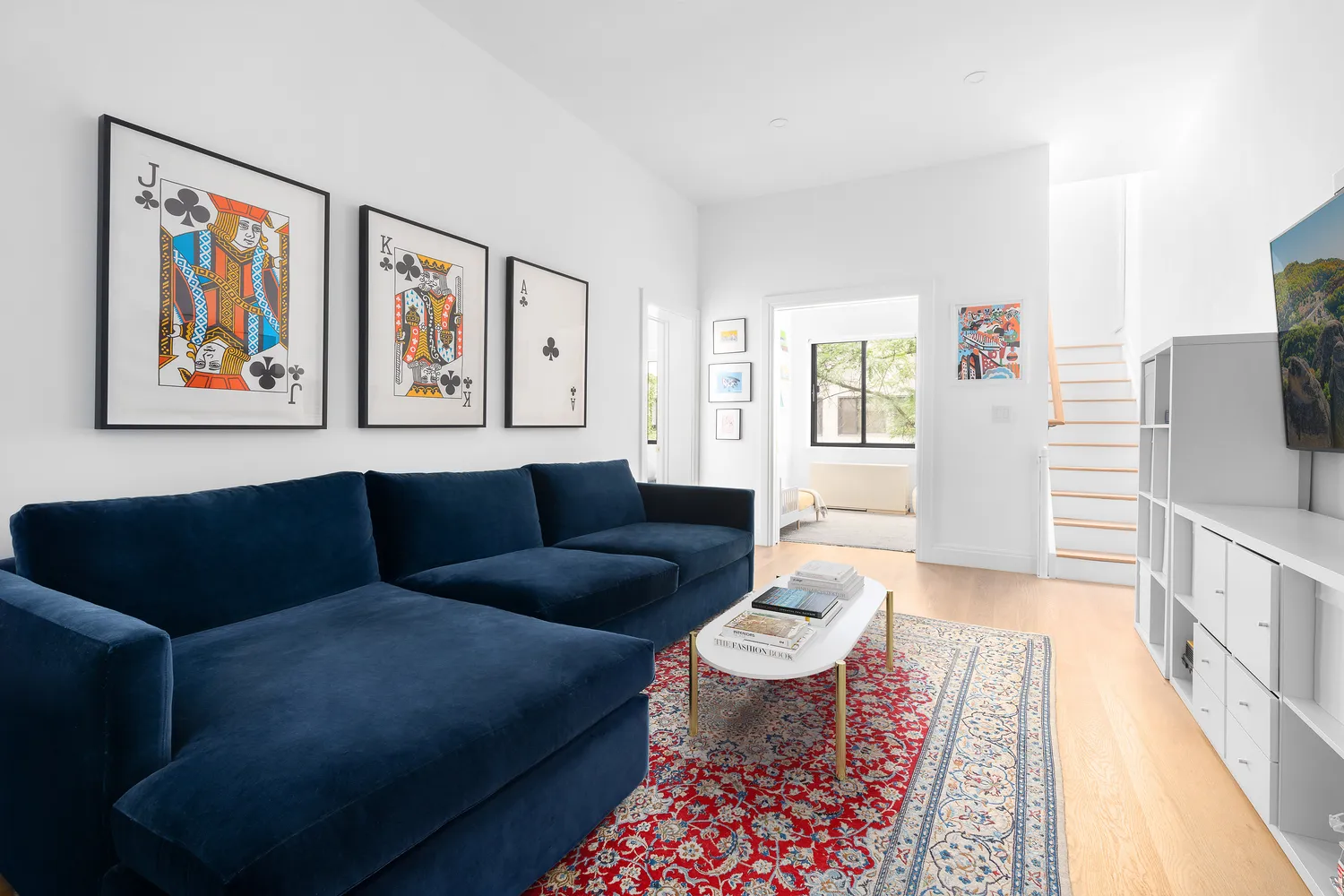 a living room with furniture and a rug