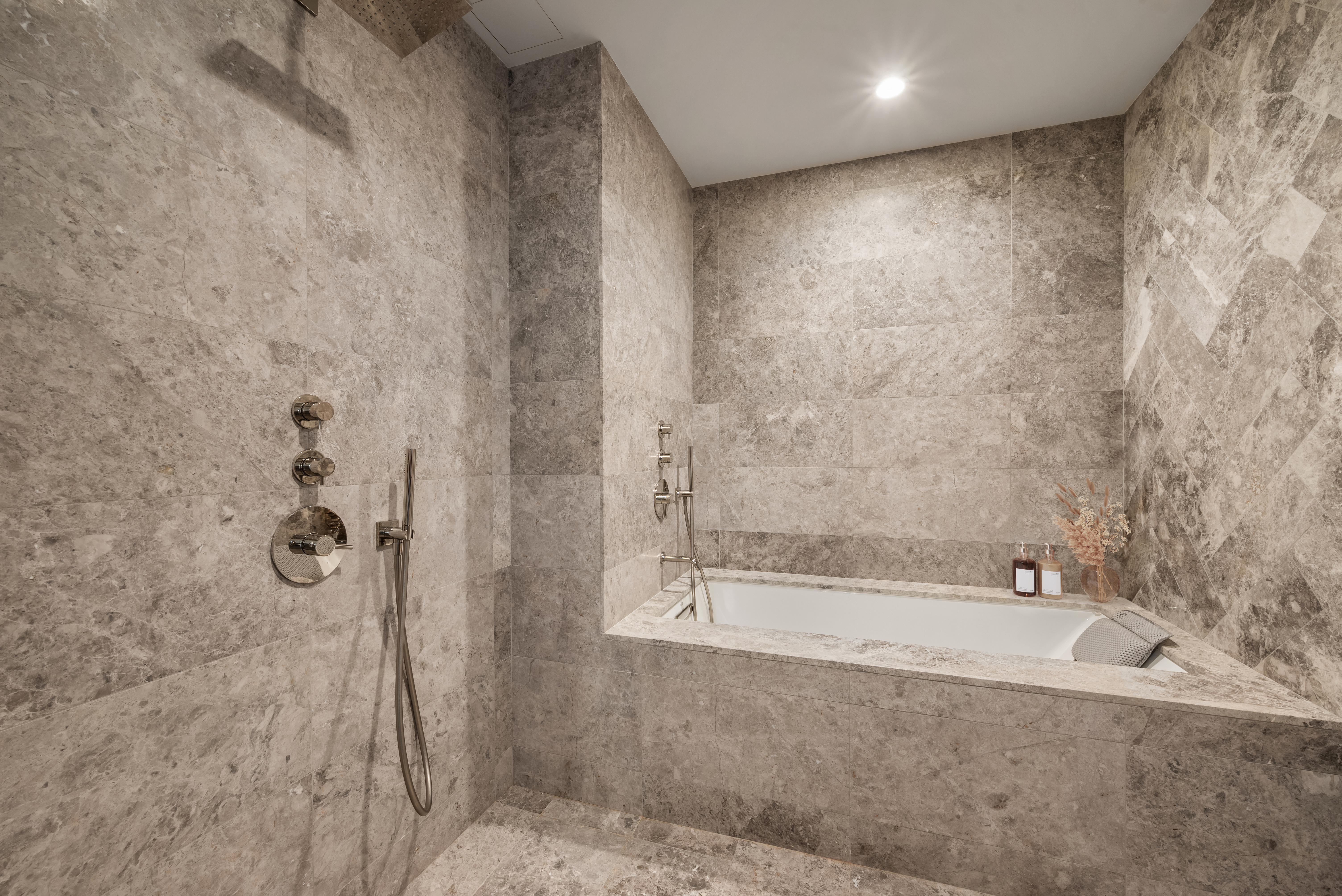 1059 3rd Avenue, Unit 18B Manhattan, NY 10065 - Photo 8 of 11 a bathroom with a bathtub and shower