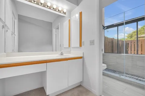 a bathroom with a bathtub and a sink