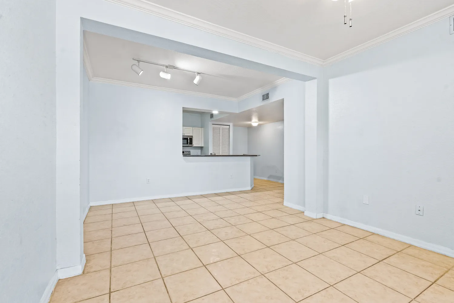 a kitchen with granite countertop a sink and a stove top oven with granite countertops