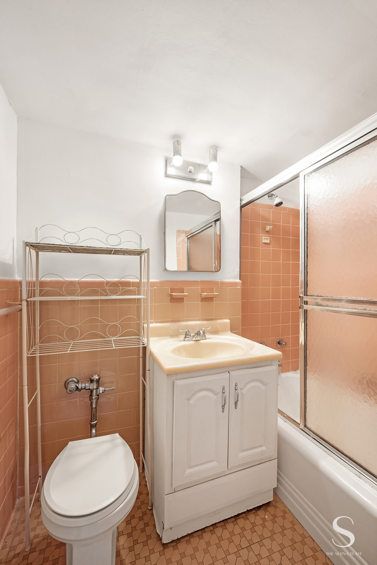 35-51 85th Street, Unit 4F Queens, NY 11372 - Photo 6 of 13 a bathroom with a sink toilet vanity and shower
