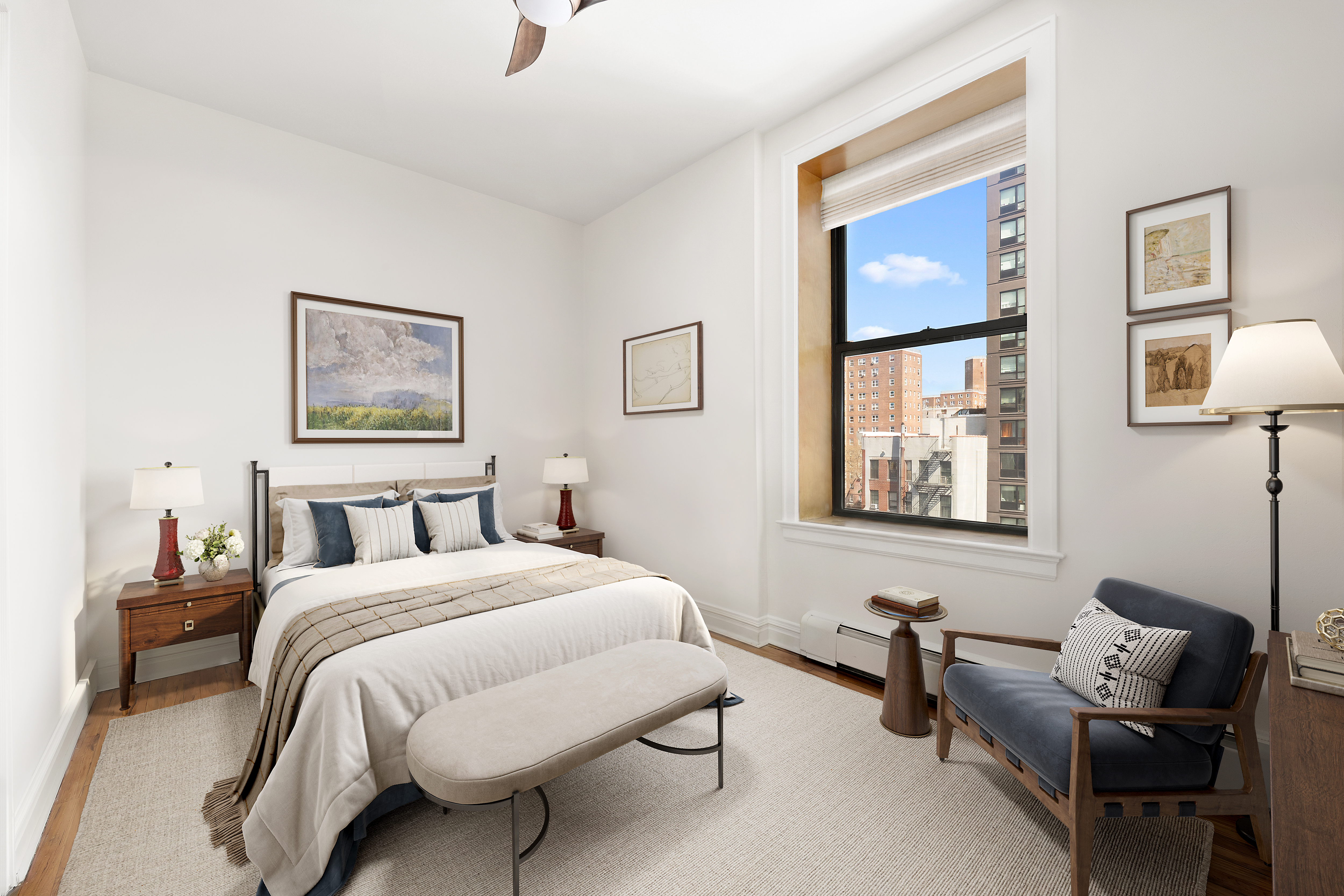 370 St Nicholas Avenue, Unit PH5B Manhattan, NY 10027 - Photo 9 of 12 a bedroom with a bed and a couch