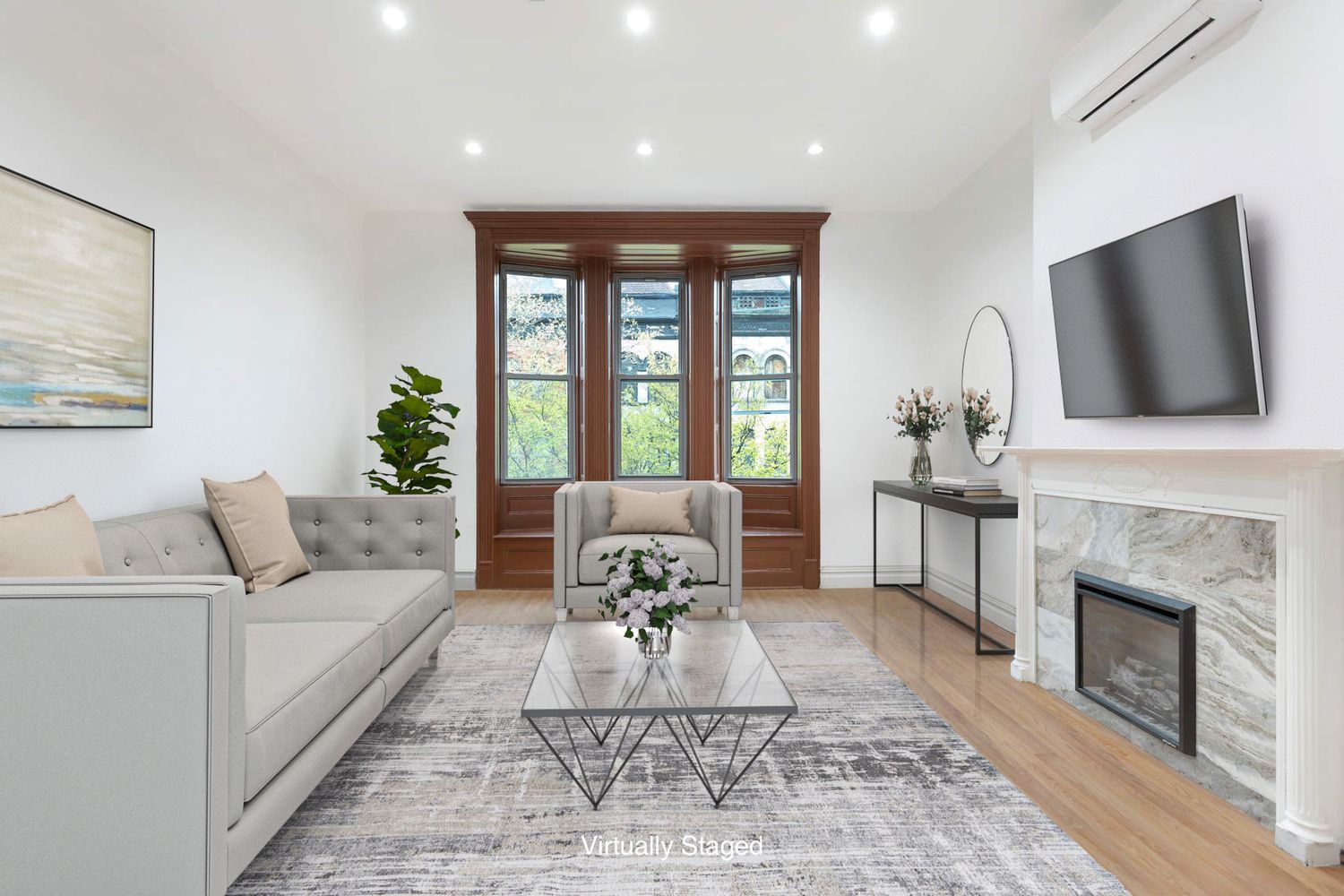 a living room with furniture a fireplace and a flat screen tv
