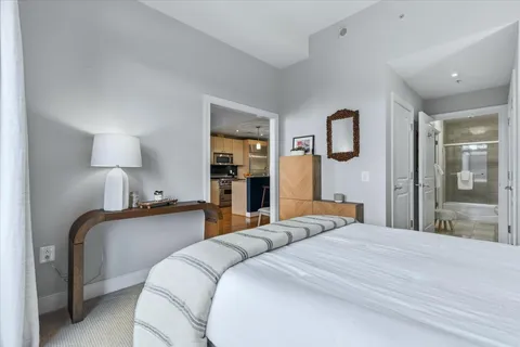 a bedroom with bed and window