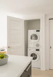 a utility room with a sink dryer and washer