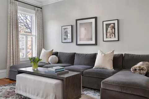a living room with furniture and window