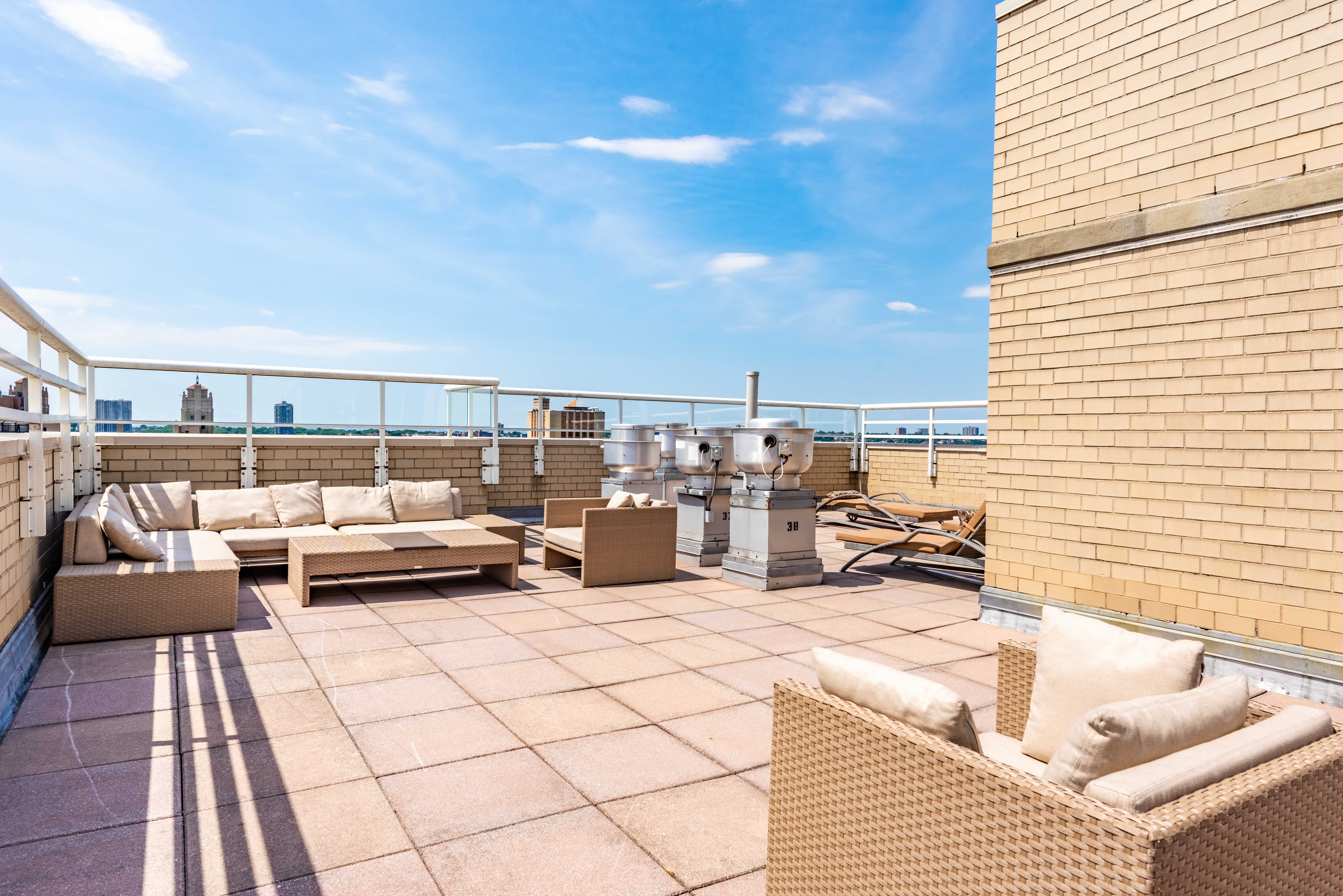 2373 Broadway, Unit 630 Manhattan, NY 10024 - Photo 13 of 17 a view of roof deck with couches and potted plants