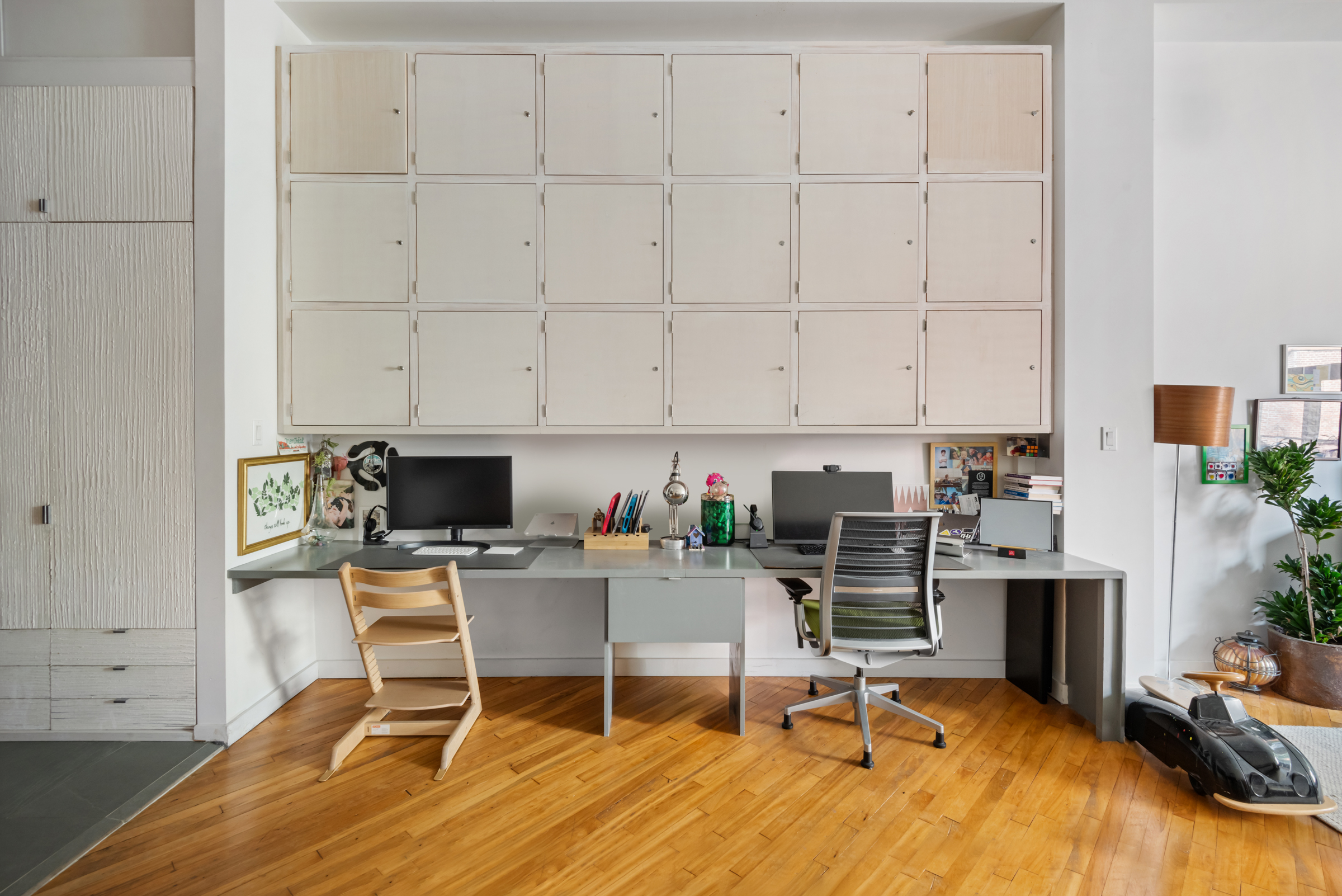 105 Lexington Avenue, Unit 2G Brooklyn, NY 11238 - Photo 8 of 17 a workspace with wooden floor and a cabinet