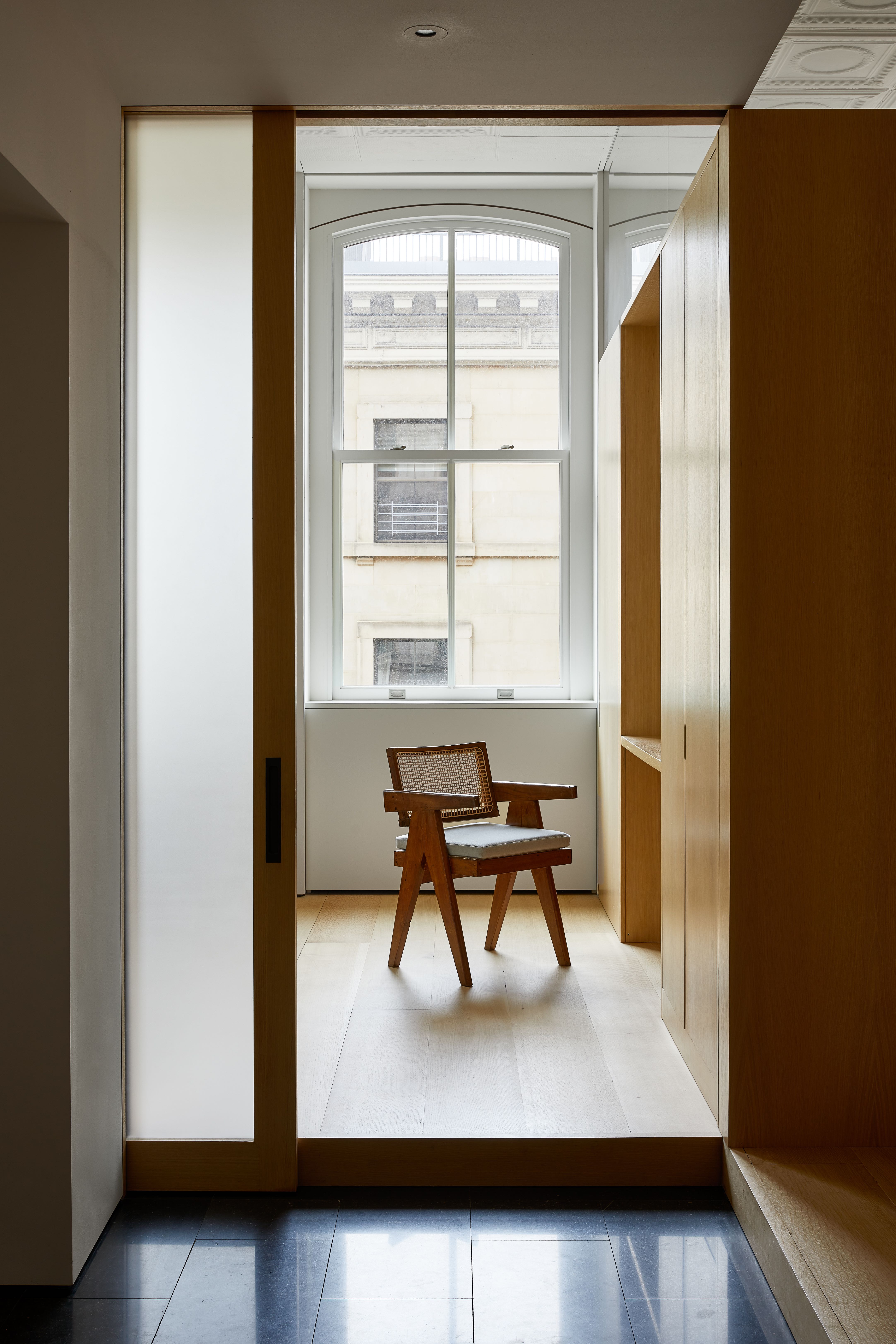 100 Grand Street, Unit 4 Manhattan, NY 10013 - Photo 10 of 13 a view of a livingroom with furniture and a window