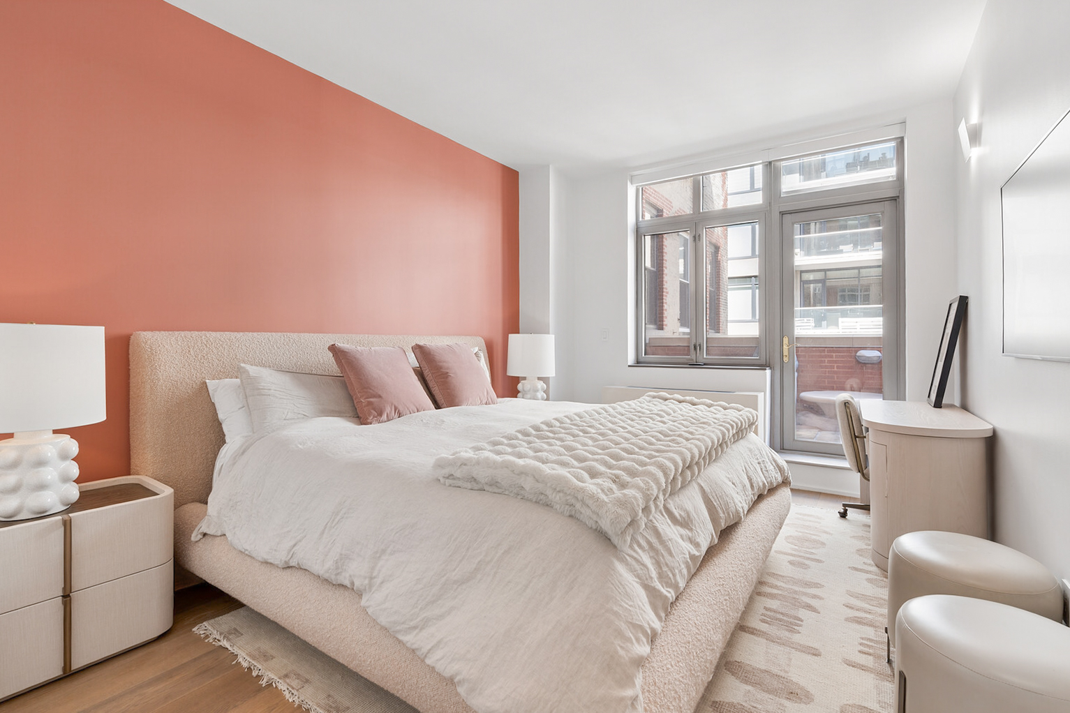 125 West 22nd Street, Unit 10A Manhattan, NY 10011 - Photo 9 of 11 a spacious bedroom with a bed and a large window
