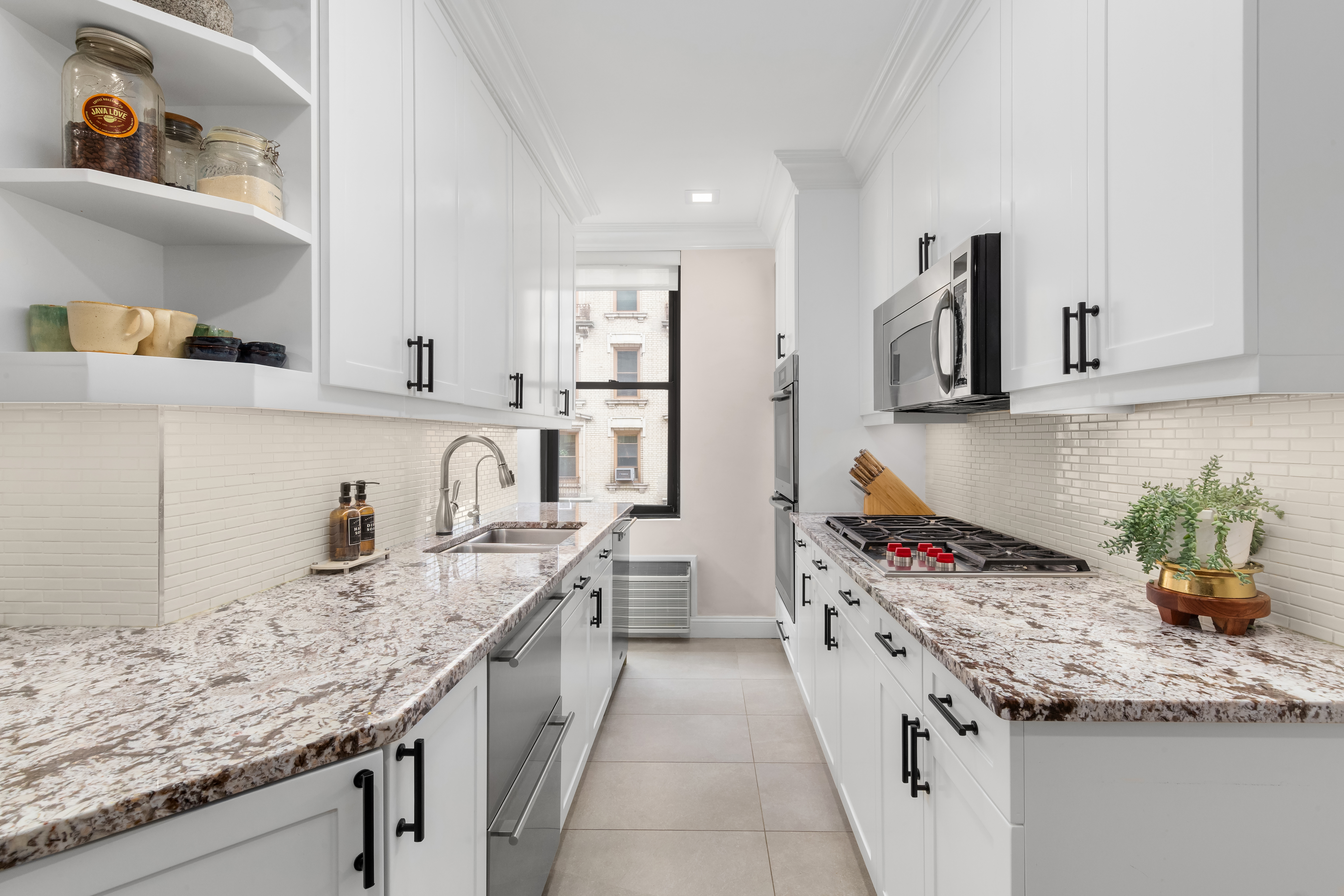 905 West End Avenue, Unit 81 Manhattan, NY 10025 - Photo 4 of 15 a kitchen with stainless steel appliances granite countertop a sink stove and cabinets