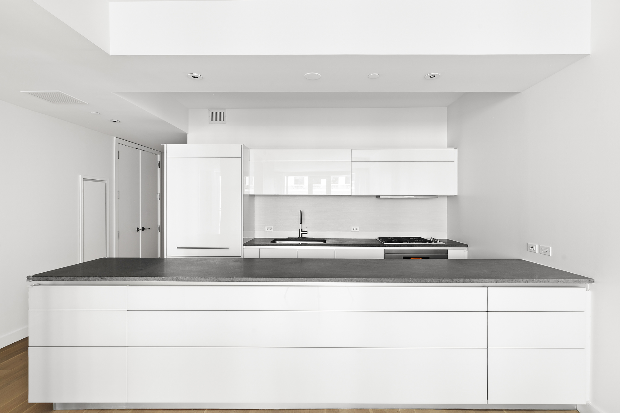 241 5th Avenue, Unit 4B Manhattan, NY 10016 - Photo 4 of 12 a view of kitchen island sink and refrigerator