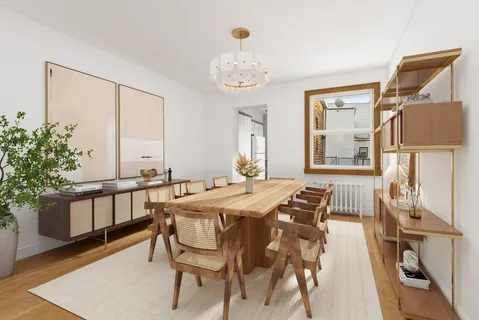 a view of a dining room with furniture and a window
