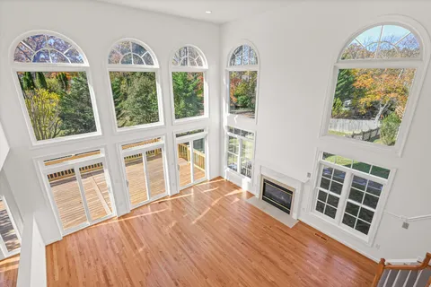 a view of an entryway with wooden floor