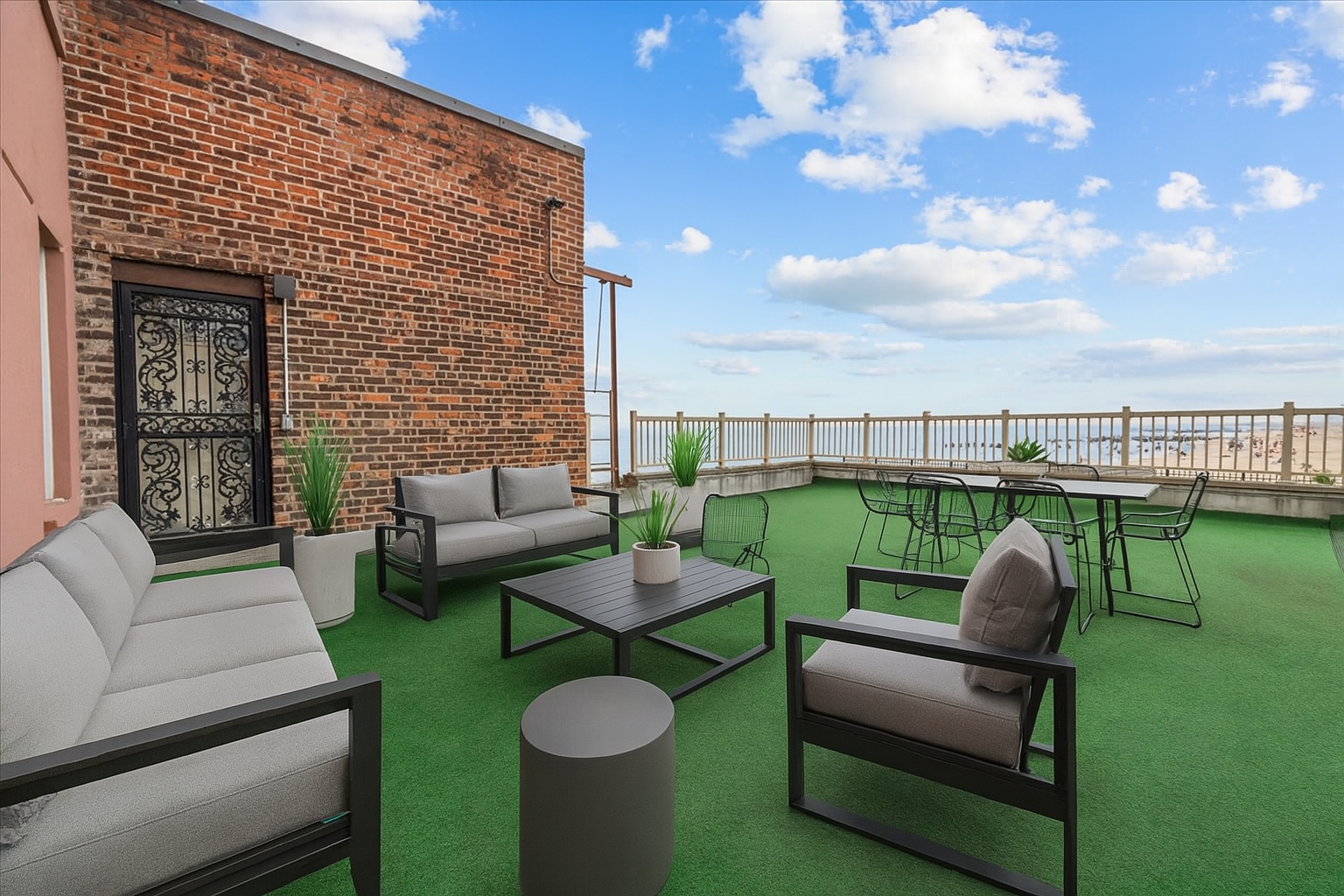286 Corbin Place, Unit 1D Brooklyn, NY 11235 - Photo 3 of 12 a view of a patio with couches chairs and a yard