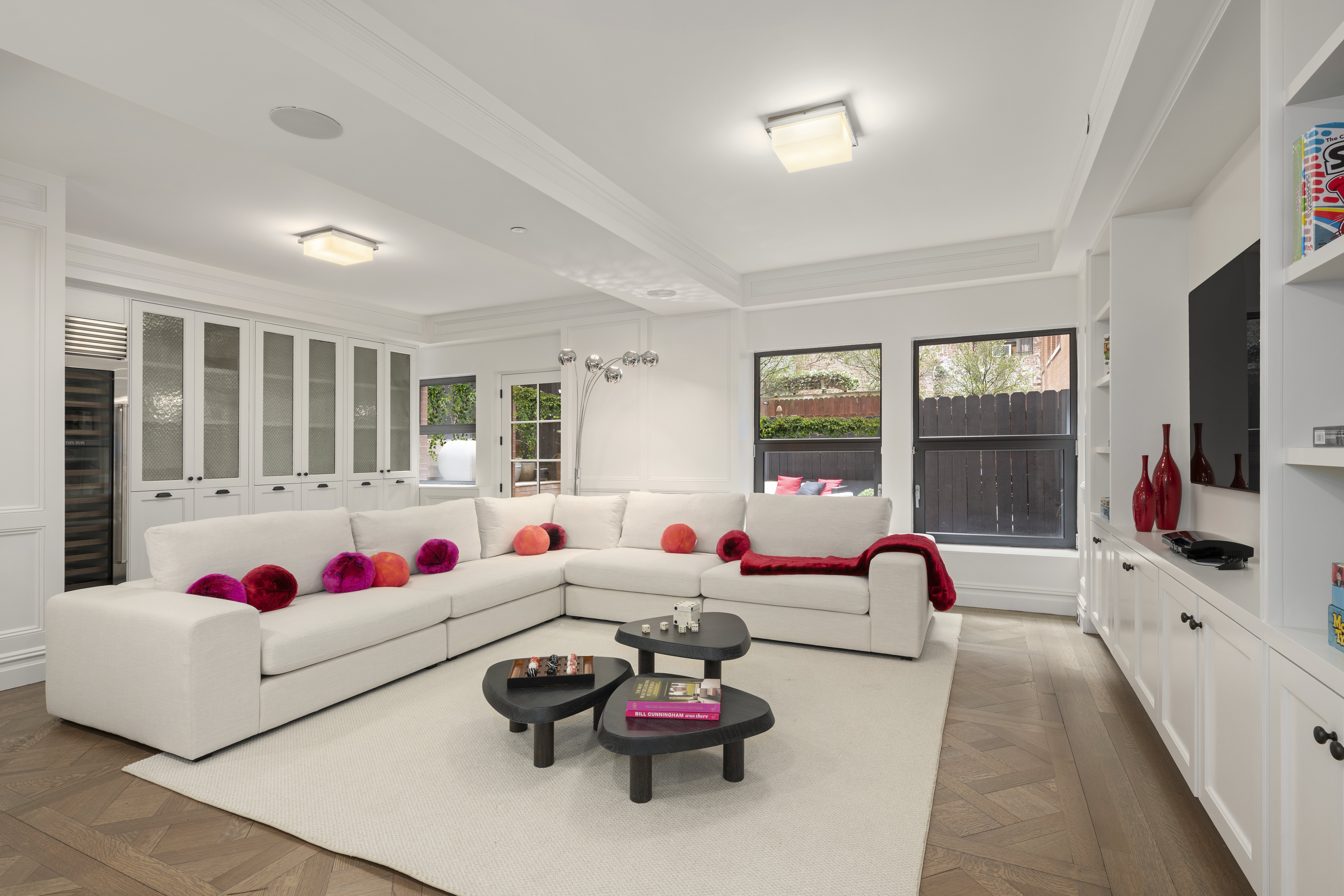 415 Washington Street, Unit 1B Manhattan, NY 10013 - Photo 12 of 16 a living room with furniture and large windows