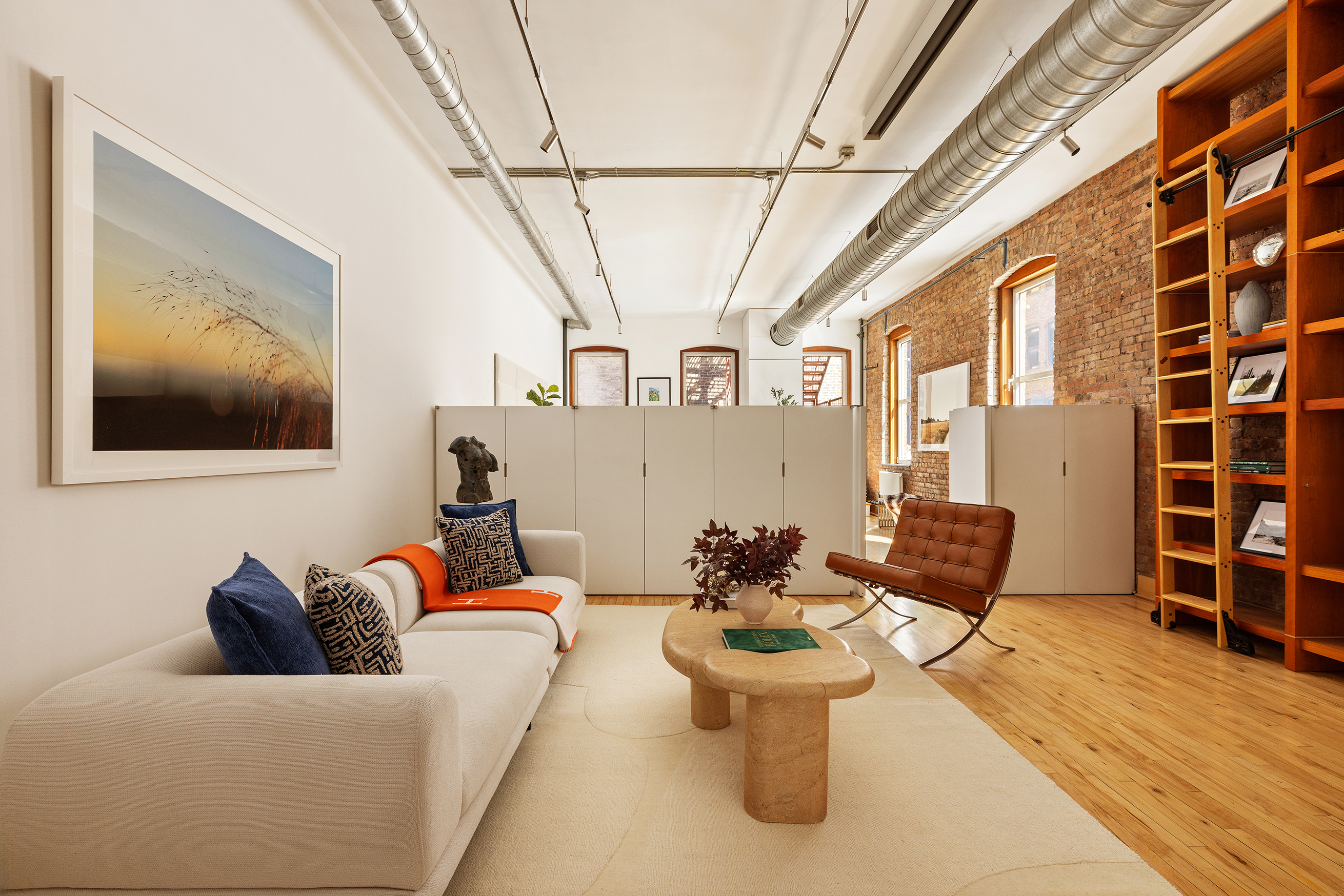 25 East 4th Street, Unit 2 Manhattan, NY 10003 - Photo 6 of 12 a living room with furniture and wooden floor
