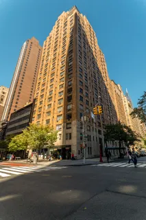a view of a tall building next to a road