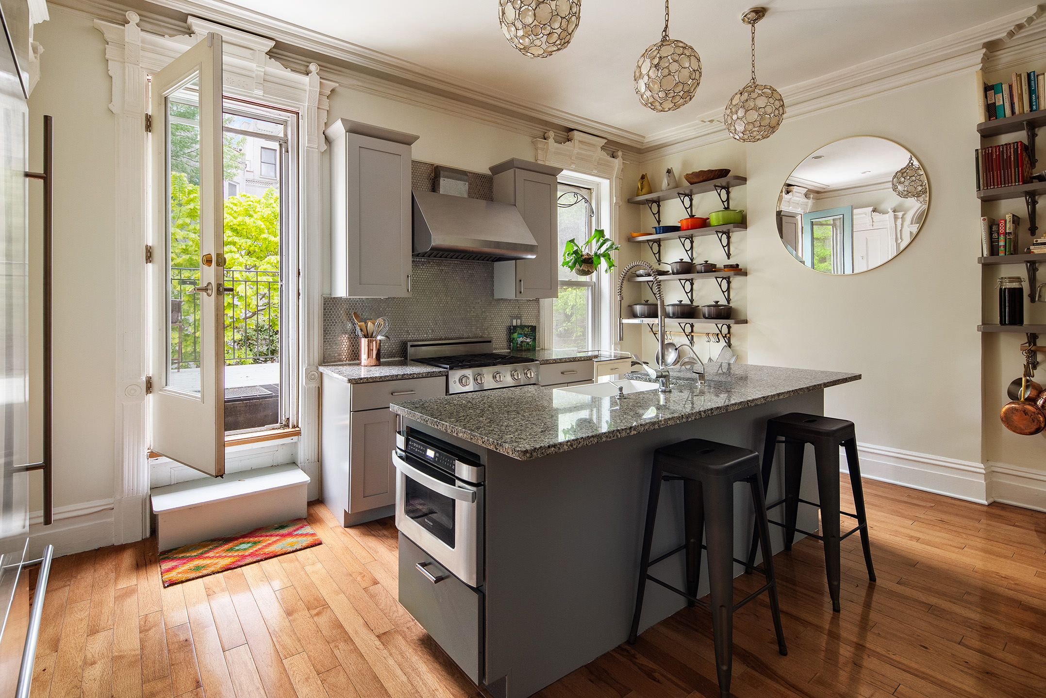 183 Halsey Street Brooklyn, NY 11216 - Photo 5 of 23 a kitchen with stainless steel appliances granite countertop a stove and a refrigerator