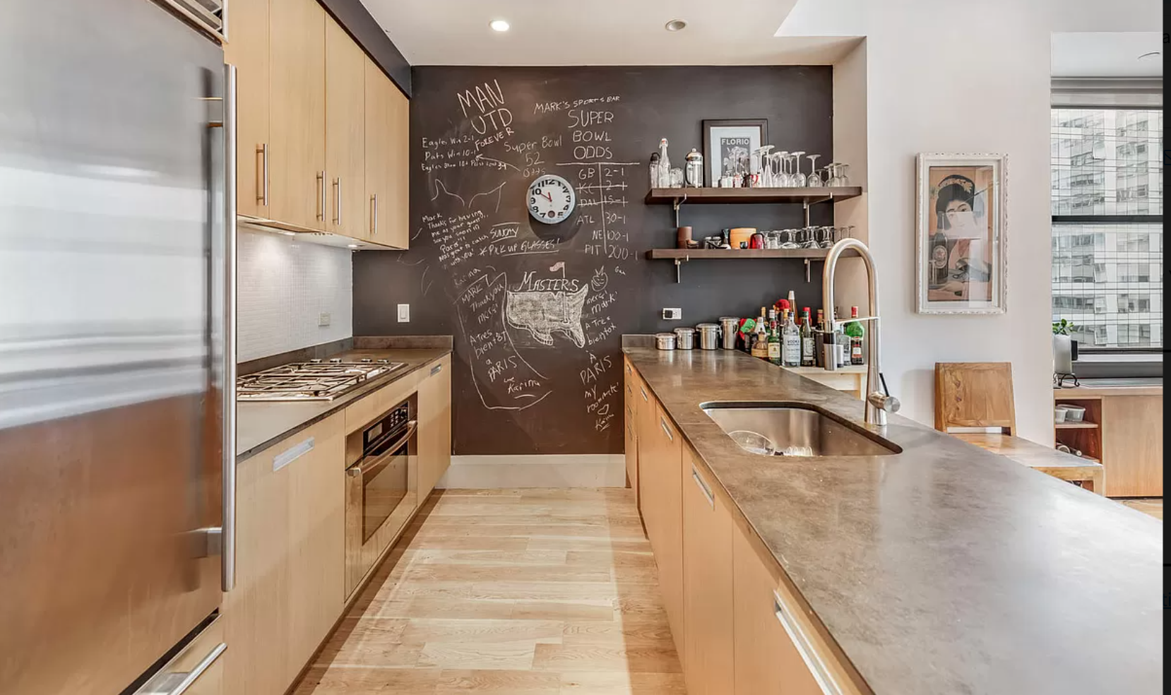71 Nassau Street, Unit 12C Manhattan, NY 10038 - Photo 5 of 18 a kitchen with stainless steel appliances granite countertop a refrigerator a stove and a sink with dishwasher