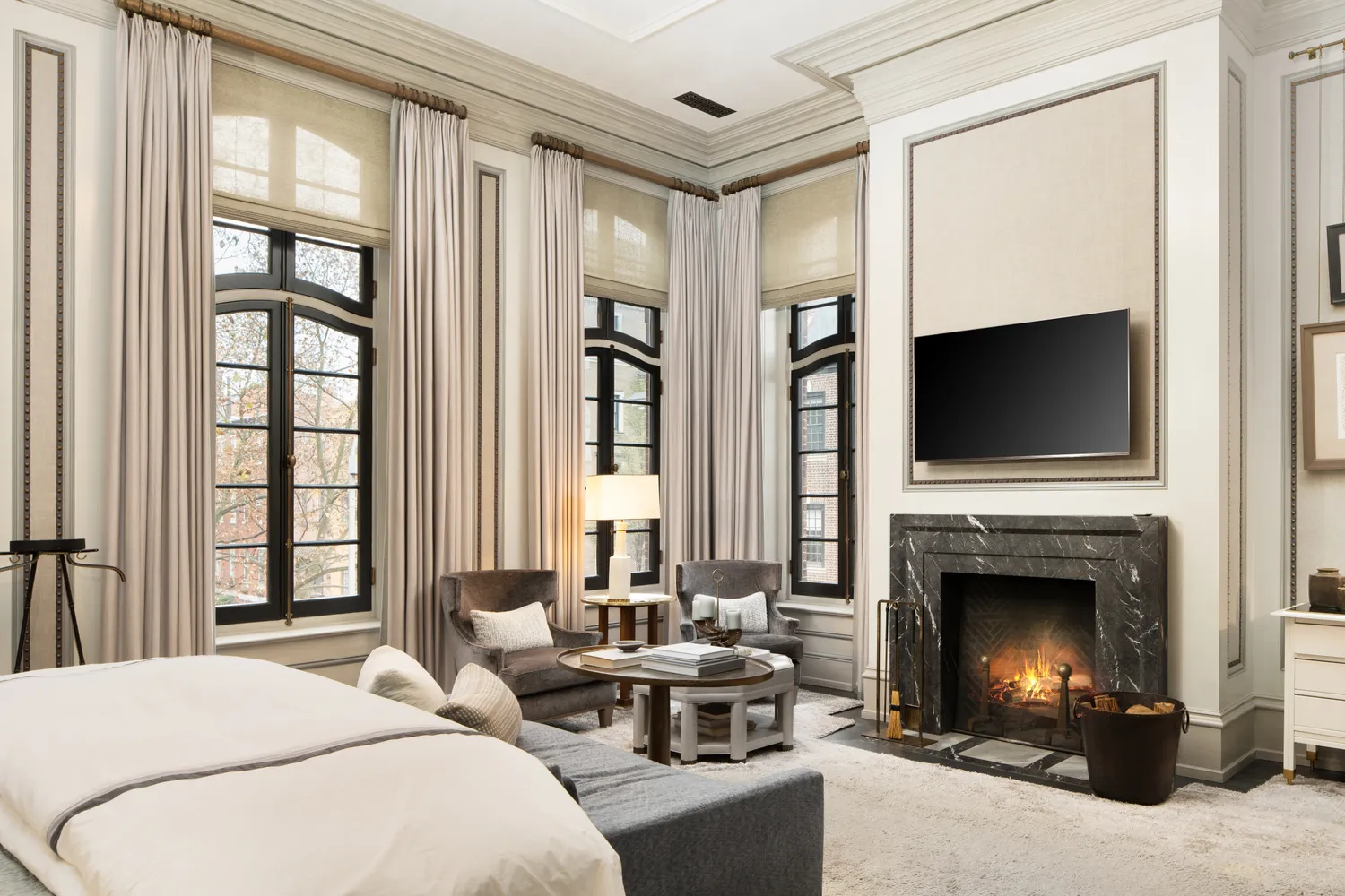 a living room with furniture fireplace and flat screen tv