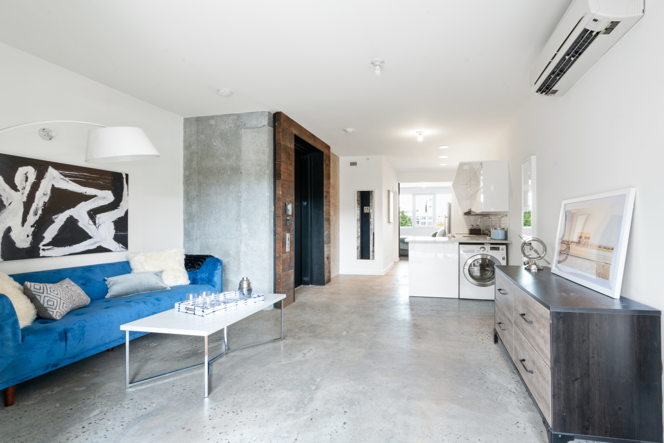 a living room with furniture and a rug
