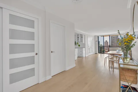 a view of a livingroom with furniture and wooden floor