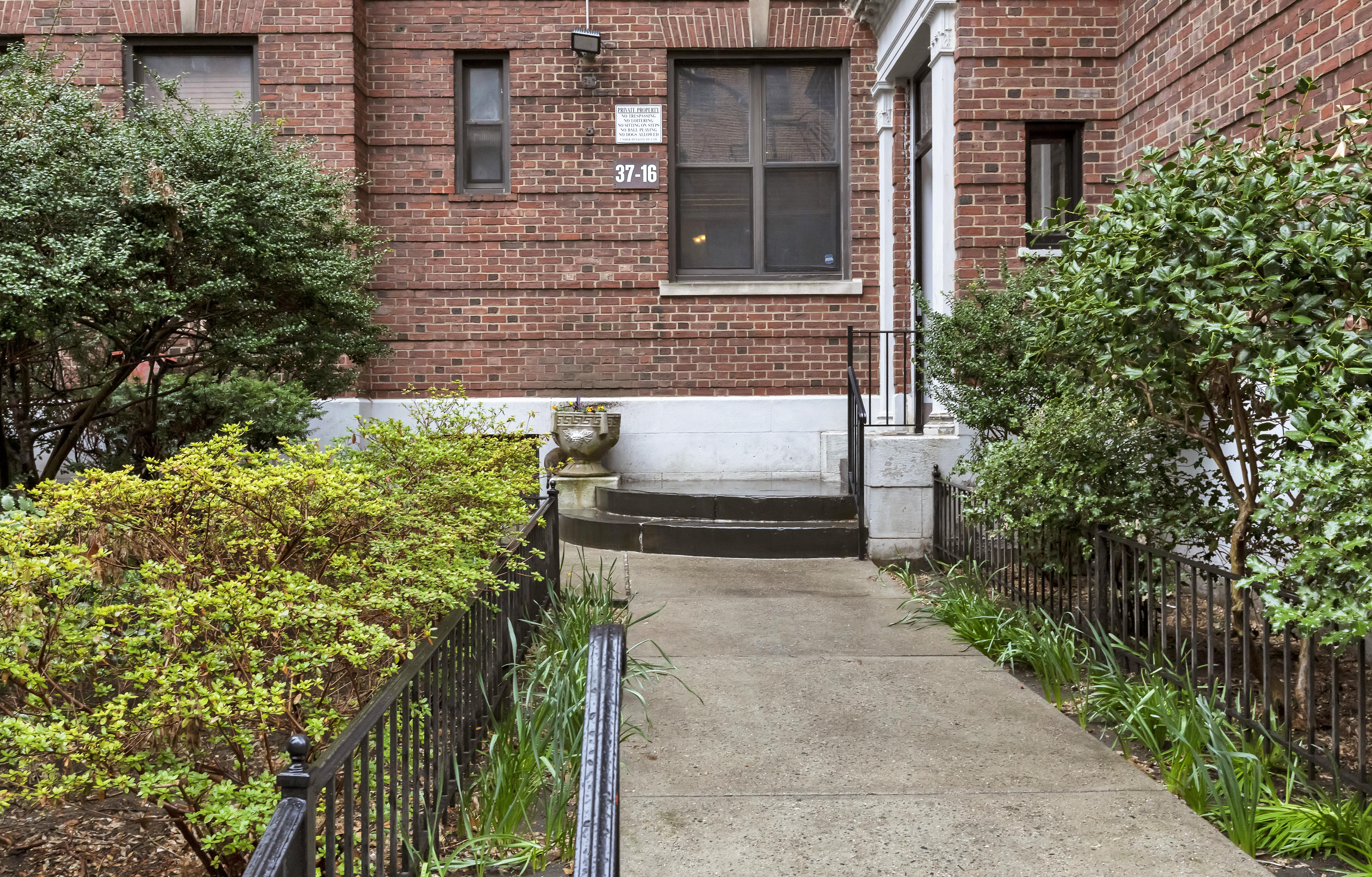 37-16 80th Street, Unit 32 Queens, NY 11372 - Photo 9 of 13 a view of a pathway along the building