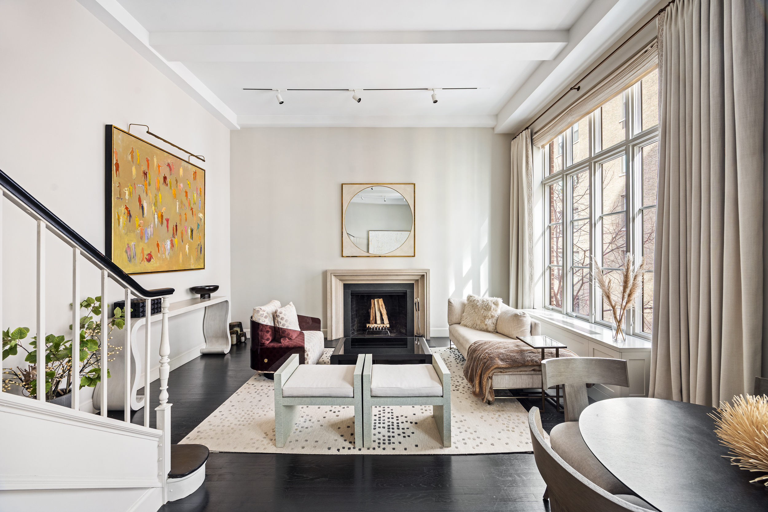 169 East 78th Street, Unit 7C Manhattan, NY 10075 - Photo 1 of 30 a living room with furniture and a fireplace