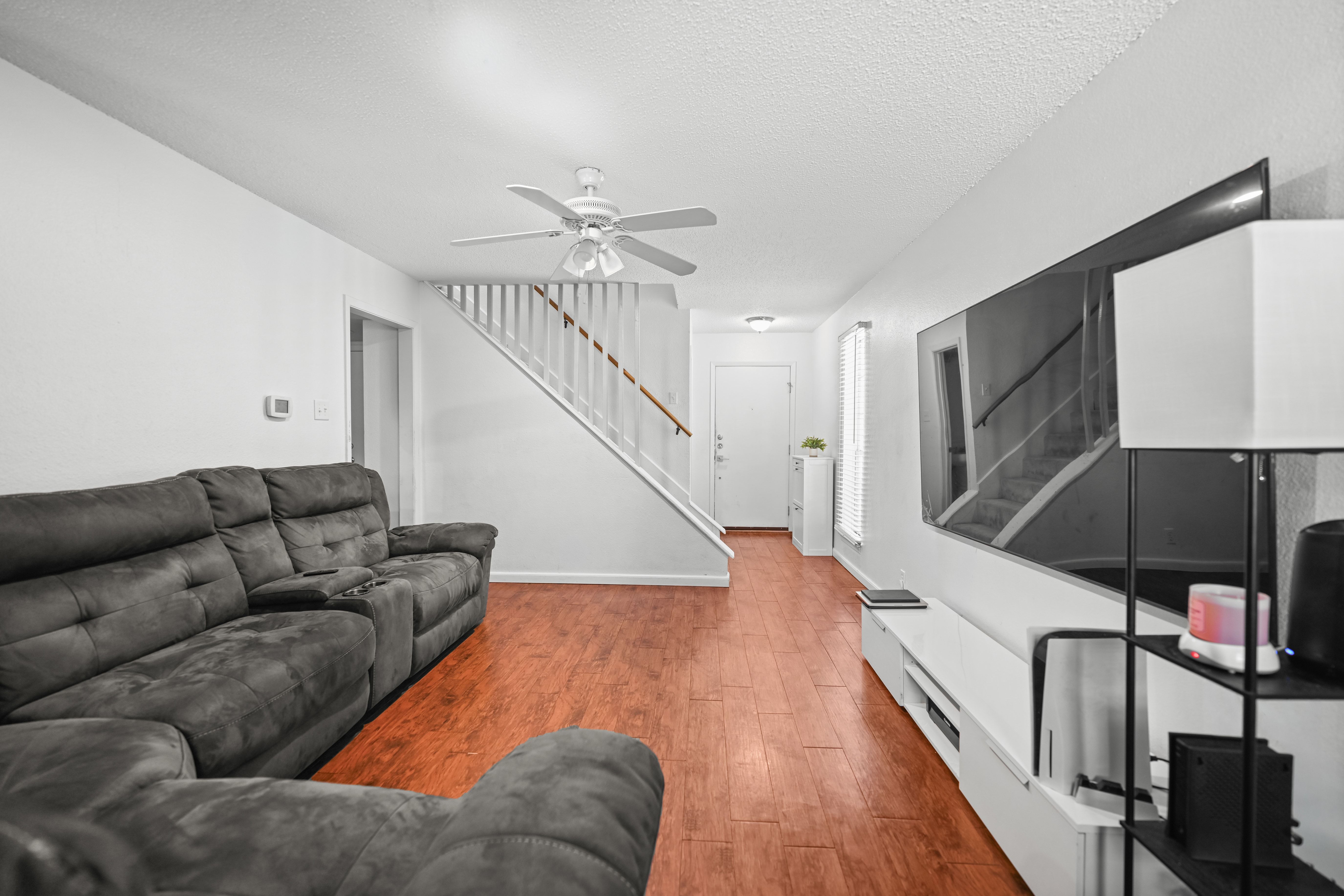 8710 Clearbrook Trail Austin, TX 78729 - Photo 17 of 28 a living room with furniture and wooden floor