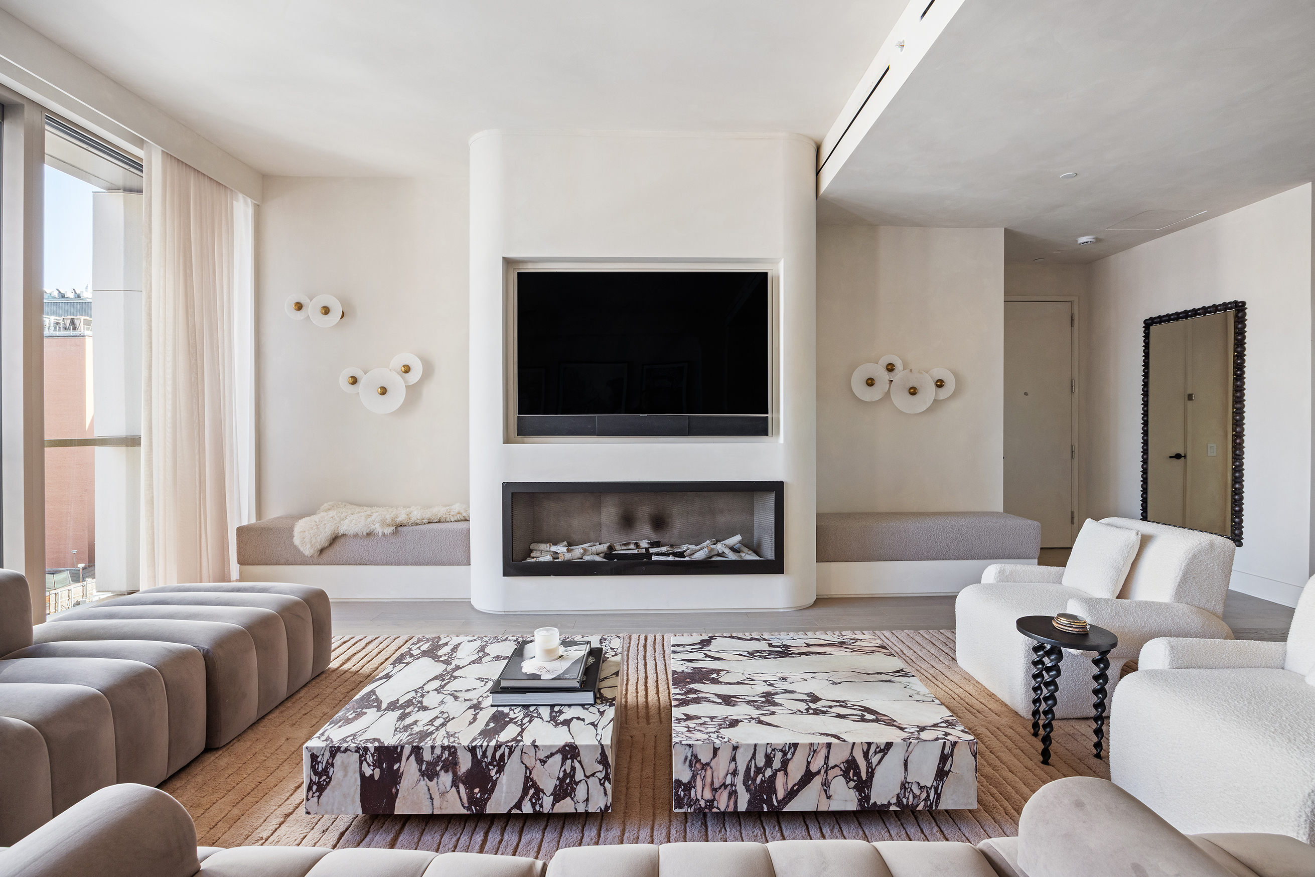 1 Great Jones Alley, Unit 10 Manhattan, NY 10012 - Photo 2 of 41 a living room with furniture and a flat screen tv