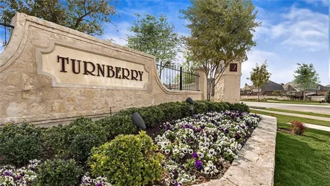 a view of a street with flower garden
