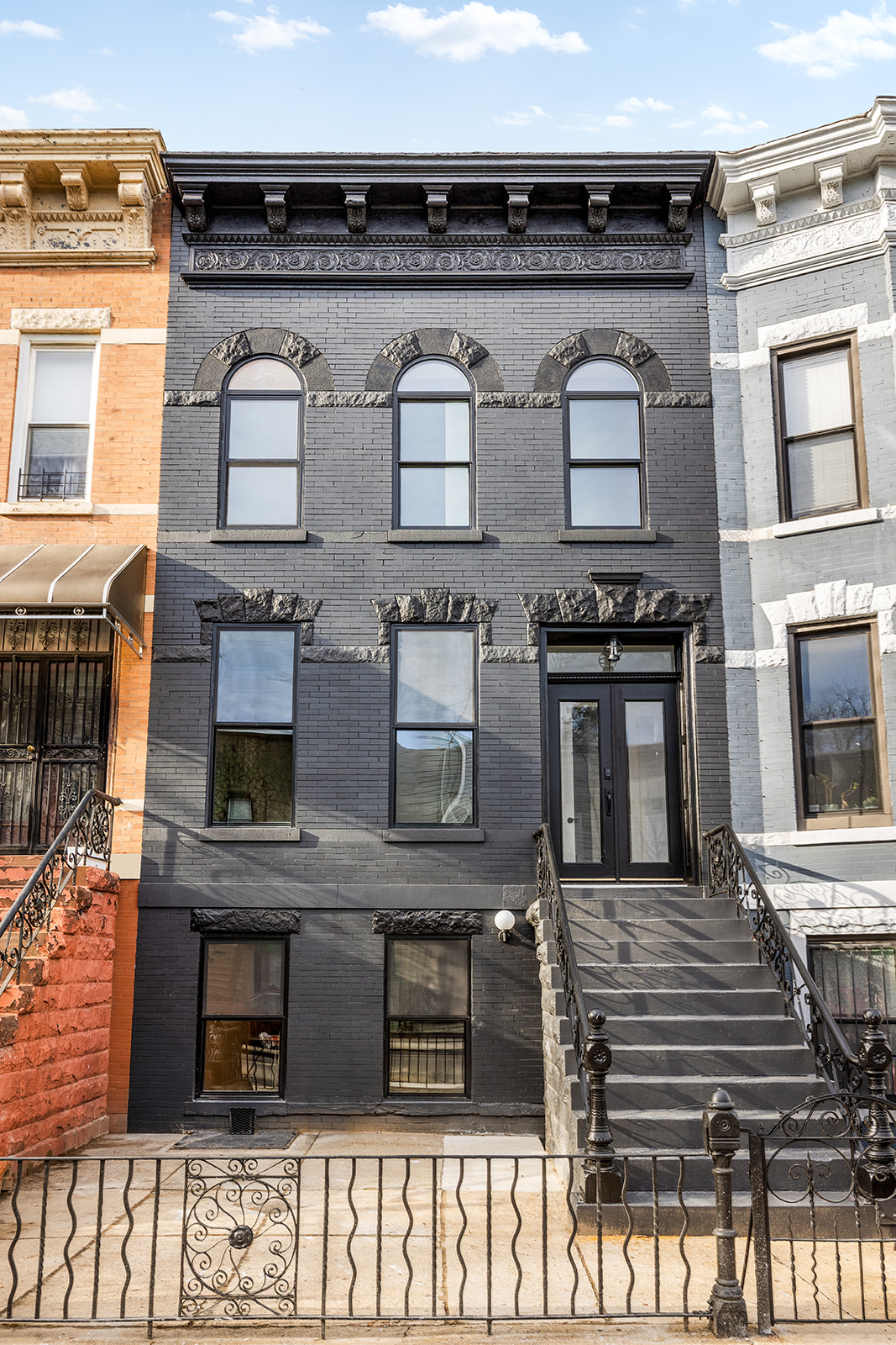 95 Moffat Street Brooklyn, NY 11207 - Photo 17 of 18 a front view of a building with glass windows