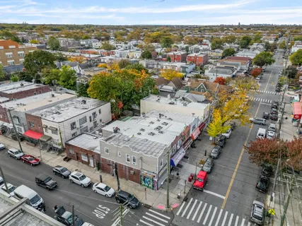 a view of a cars park in front of a building