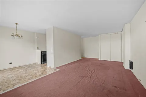 a view of empty room with ceiling fan