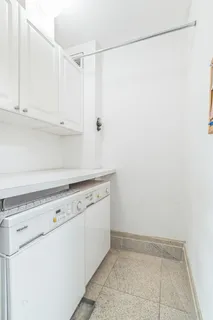 a view of a storage and utility room with closet