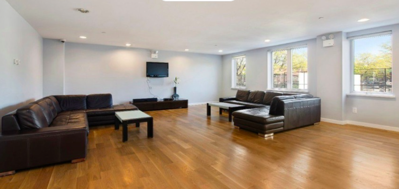 343 4th Avenue, Unit 2C Brooklyn, NY 11215 - Photo 10 of 12 a living room with furniture and a flat screen tv