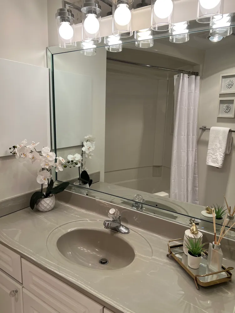 a bathroom with a sink and a mirror