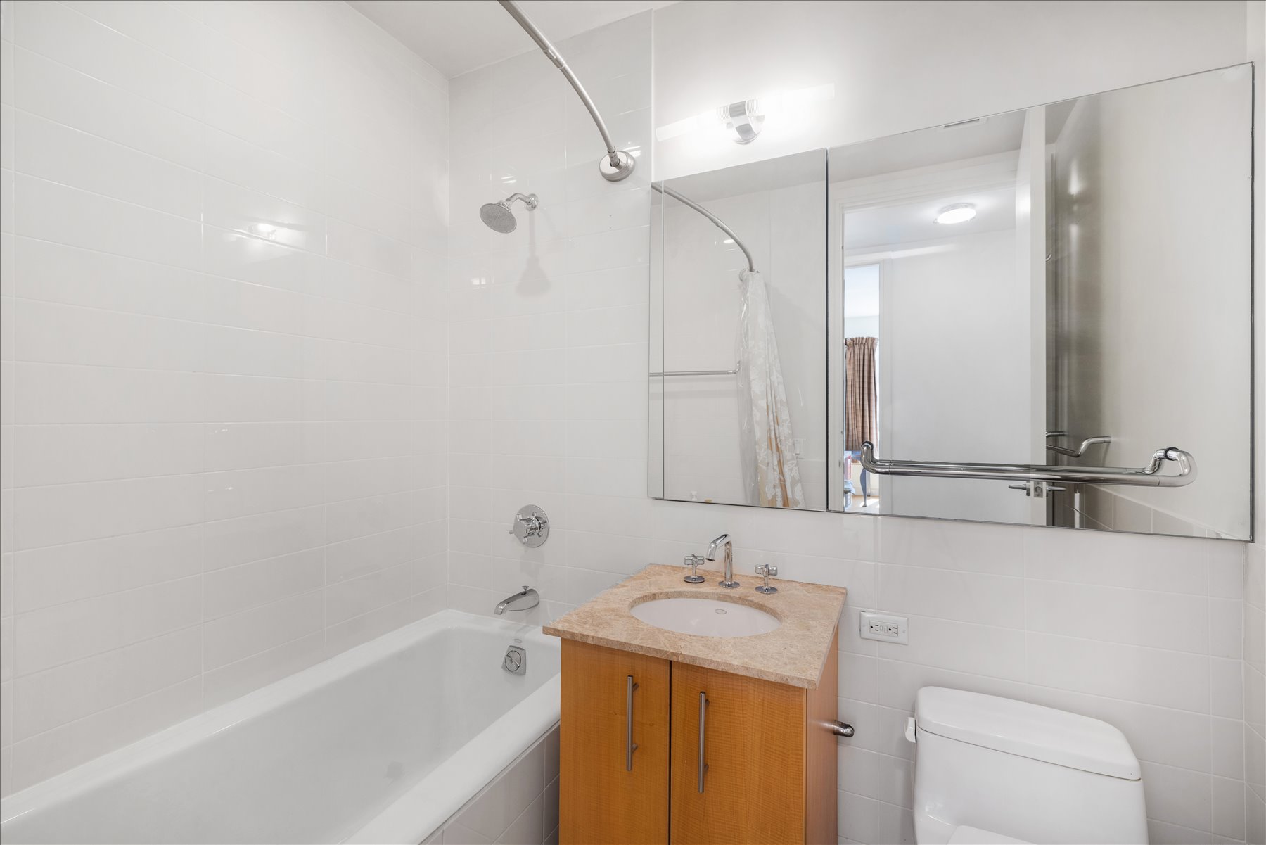 545 West 110th Street, Unit 2B Manhattan, NY 10025 - Photo 7 of 8 a bathroom with a granite countertop sink a toilet and shower