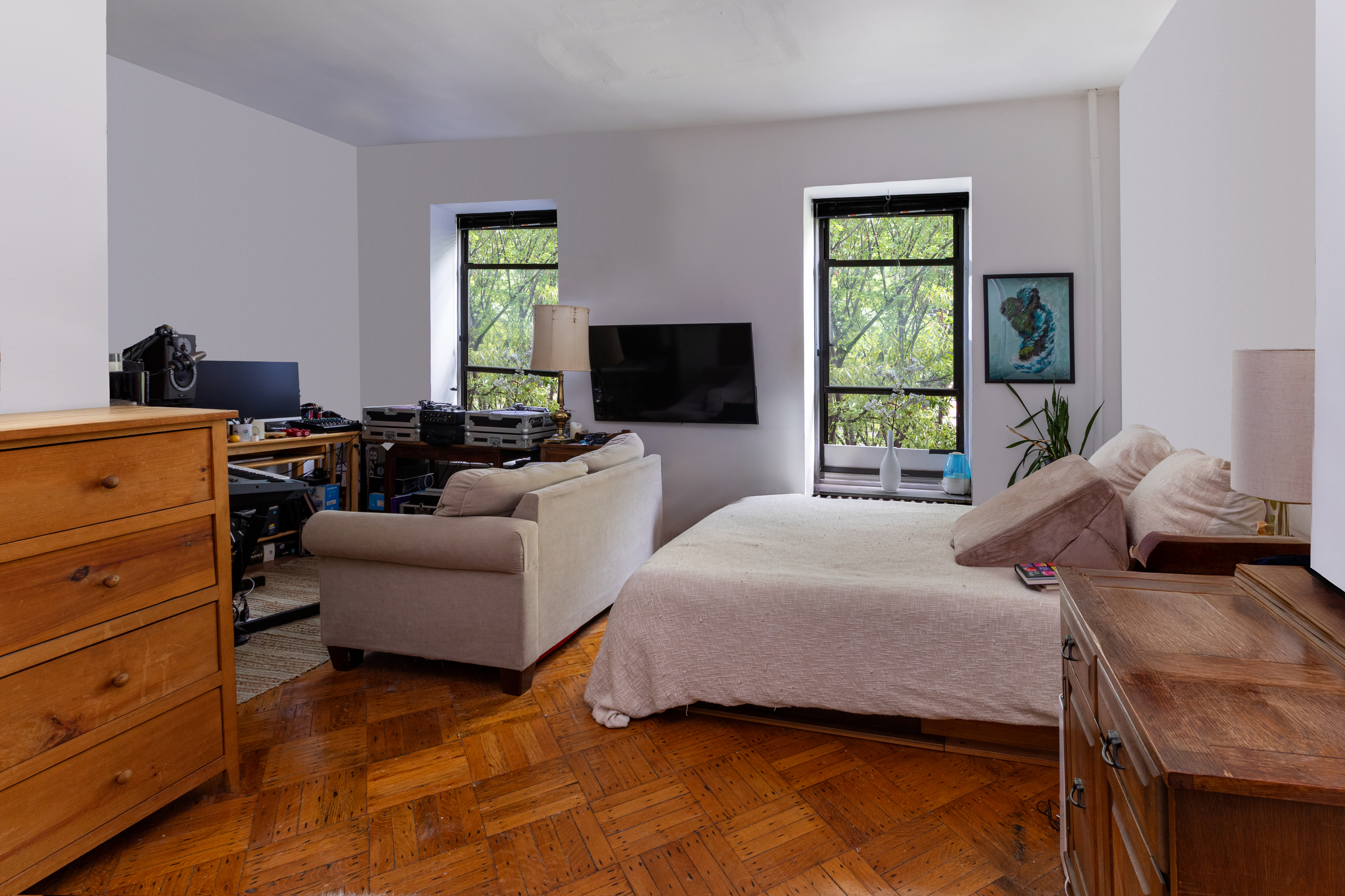 73 Monroe Street Brooklyn, NY 11216 - Photo 9 of 14 a bedroom with a bed and a couch