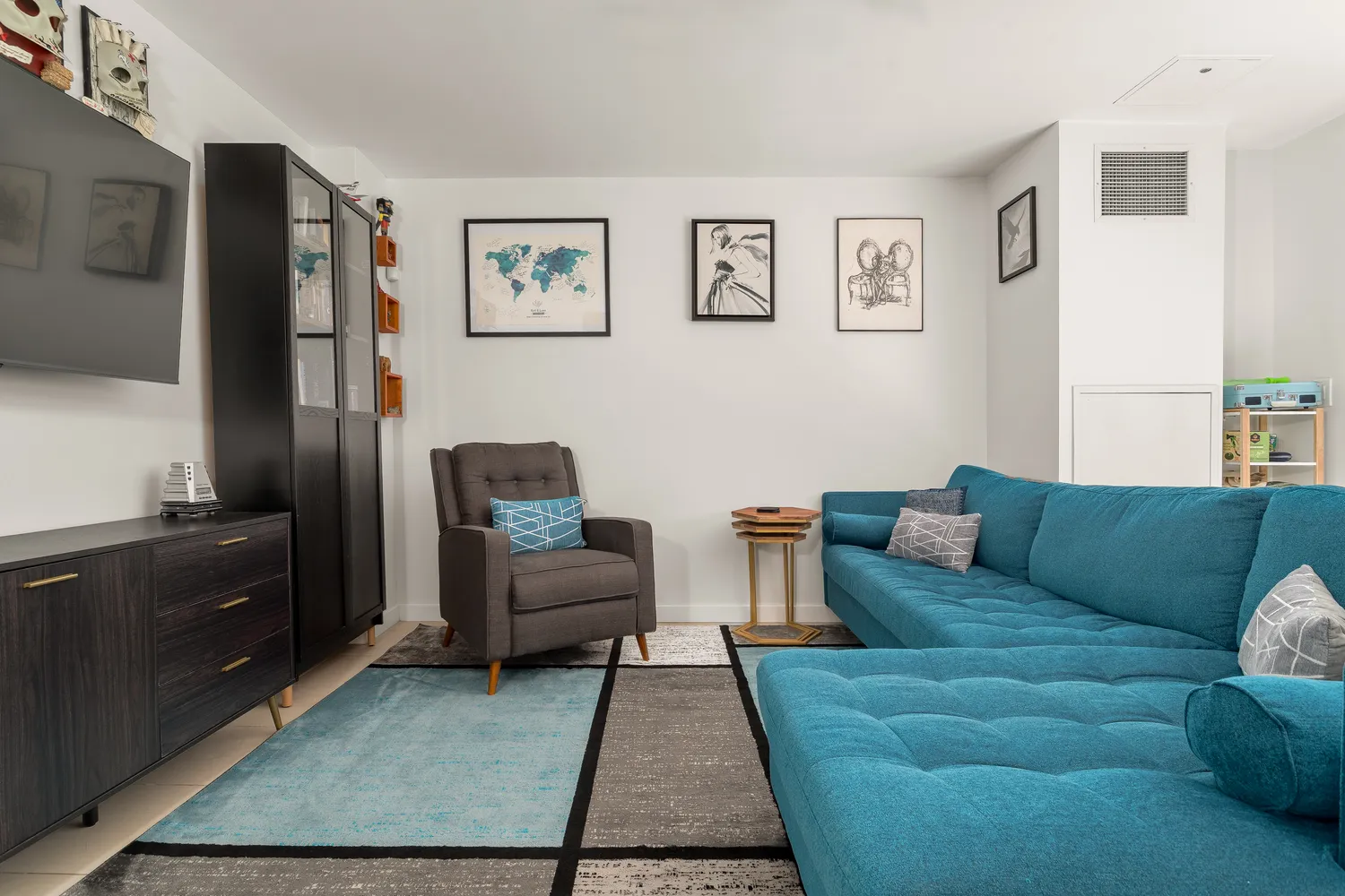 a living room with furniture and a rug