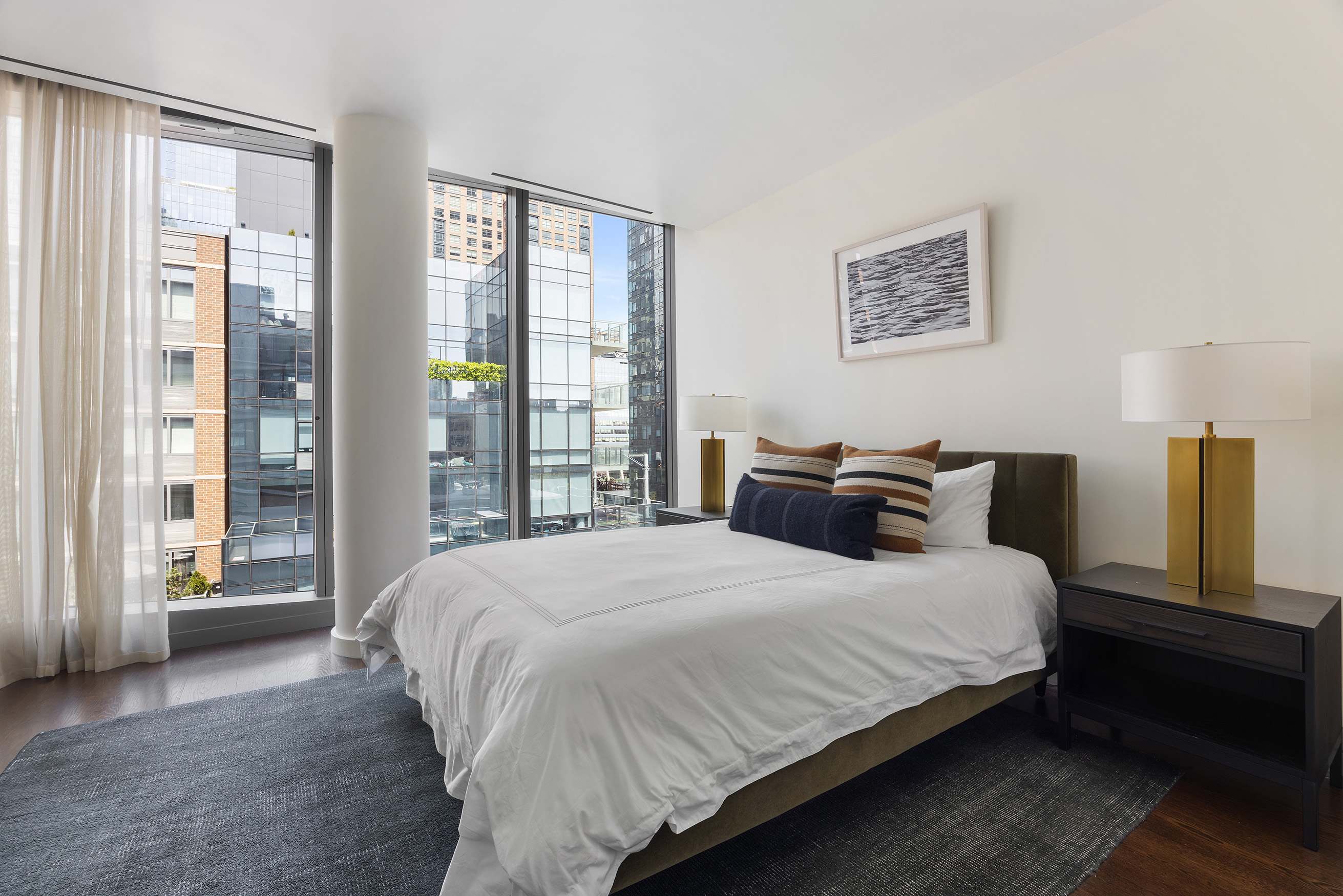 520 West 28th Street, Unit PH37 Manhattan, NY 10001 - Photo 36 of 45 a bedroom with a large bed and a large window